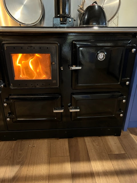 Wood fired stove burning brightly, ready for winter