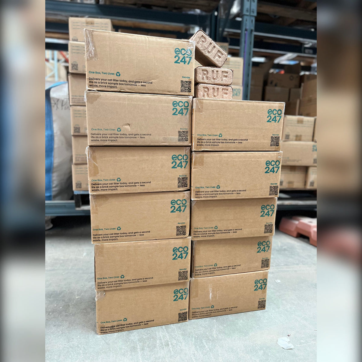11 x 12kg Eco247 boxes of Kiln-Dried Hardwood Bricks stacked in the warehouse
